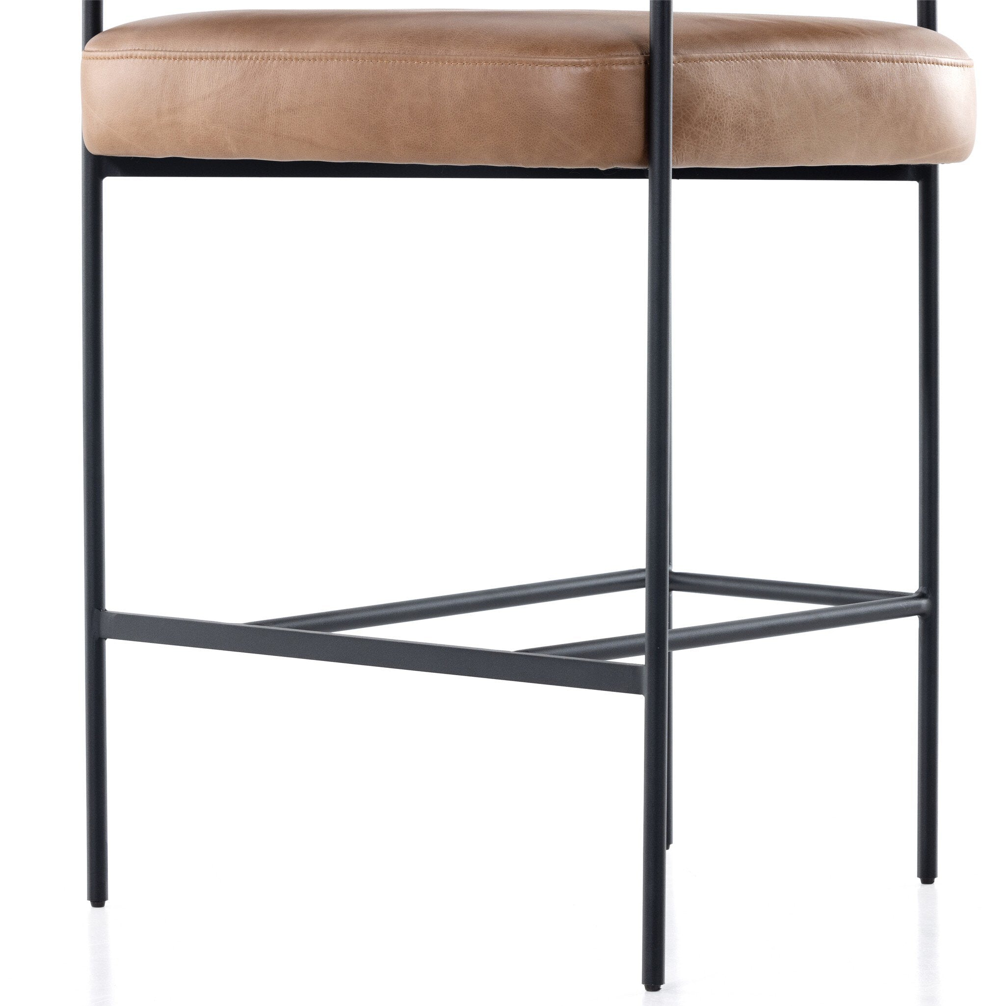 Tan counter stool underside view with black metal crossbar support under the seat