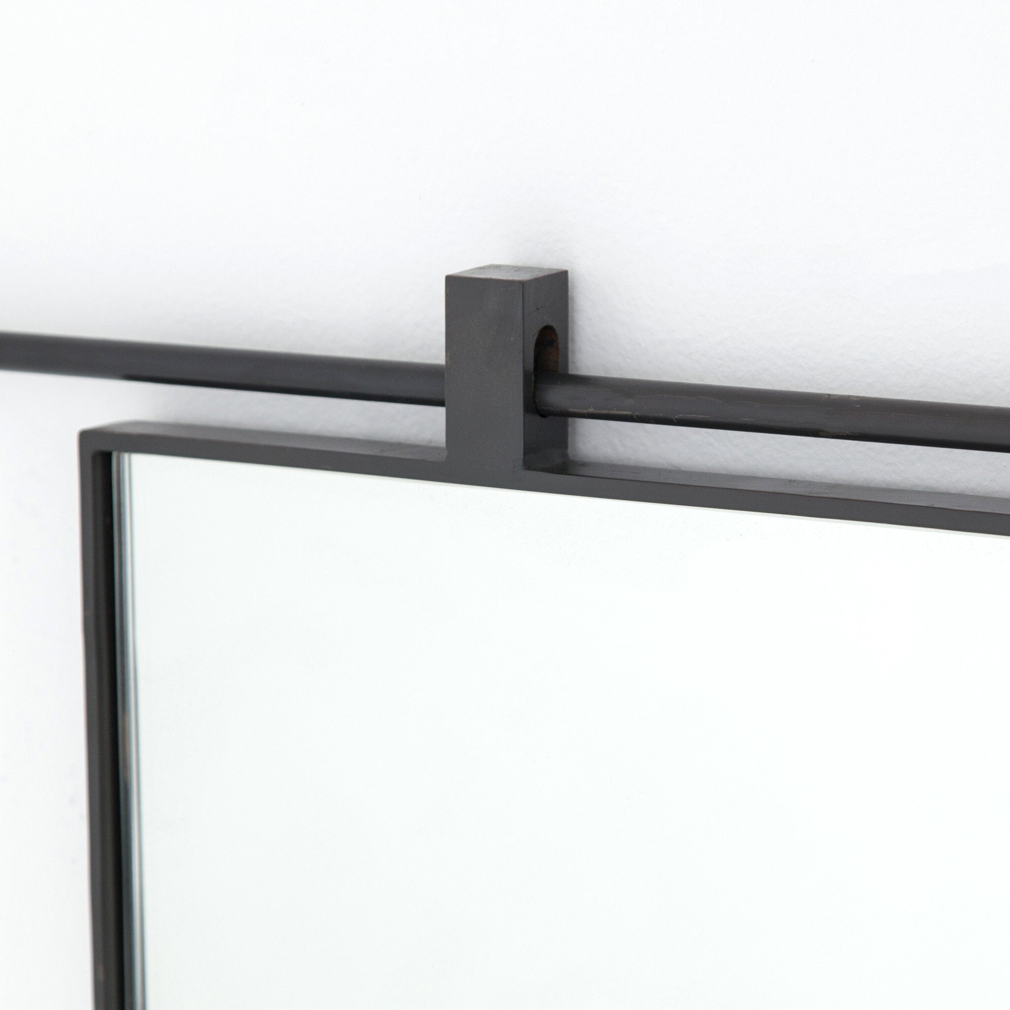 Black iron detail Chico square wall mirror featuring a unique vertical suspension bar in a hand-applied antiqued iron finish