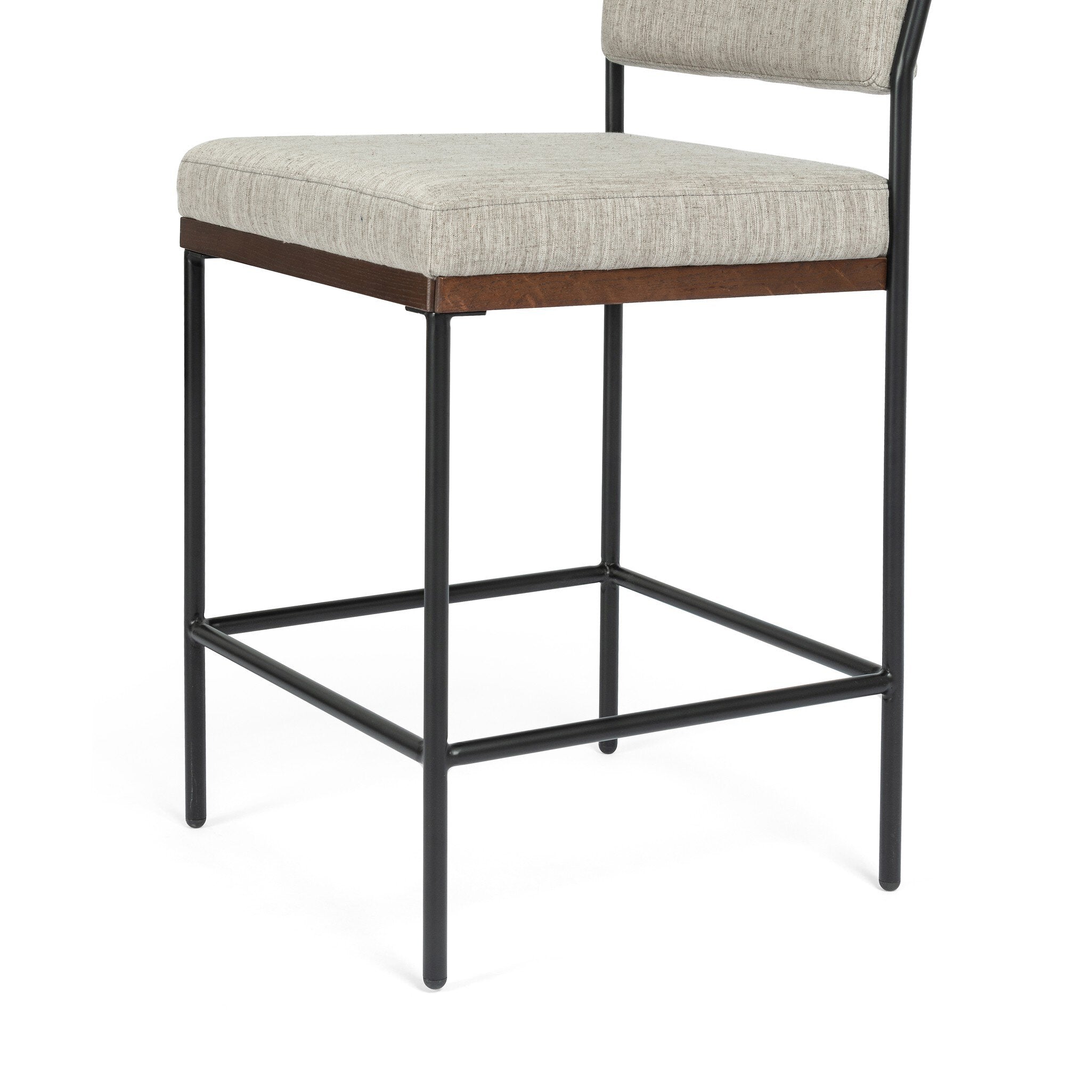 Counter stool with light gray upholstered seat and black metal base with cross brace