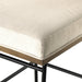Bar stool cushion edge with light upholstery fabric and stitched seam detail