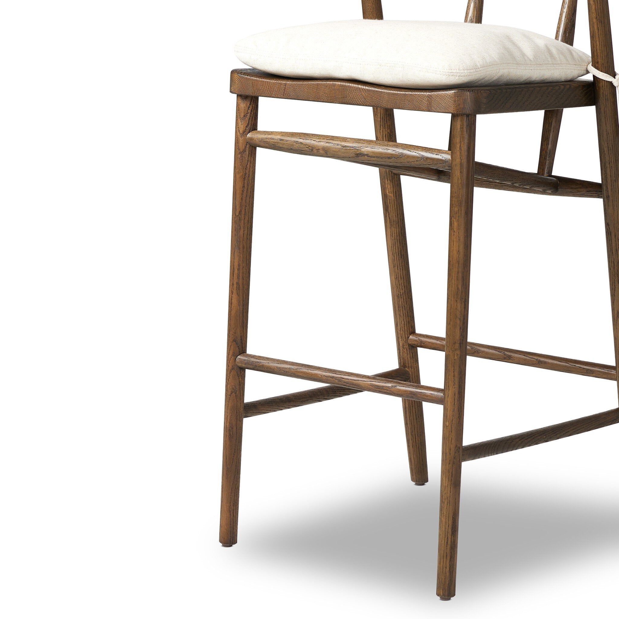 Brown wooden bar stool with cream padded seat and open back frame