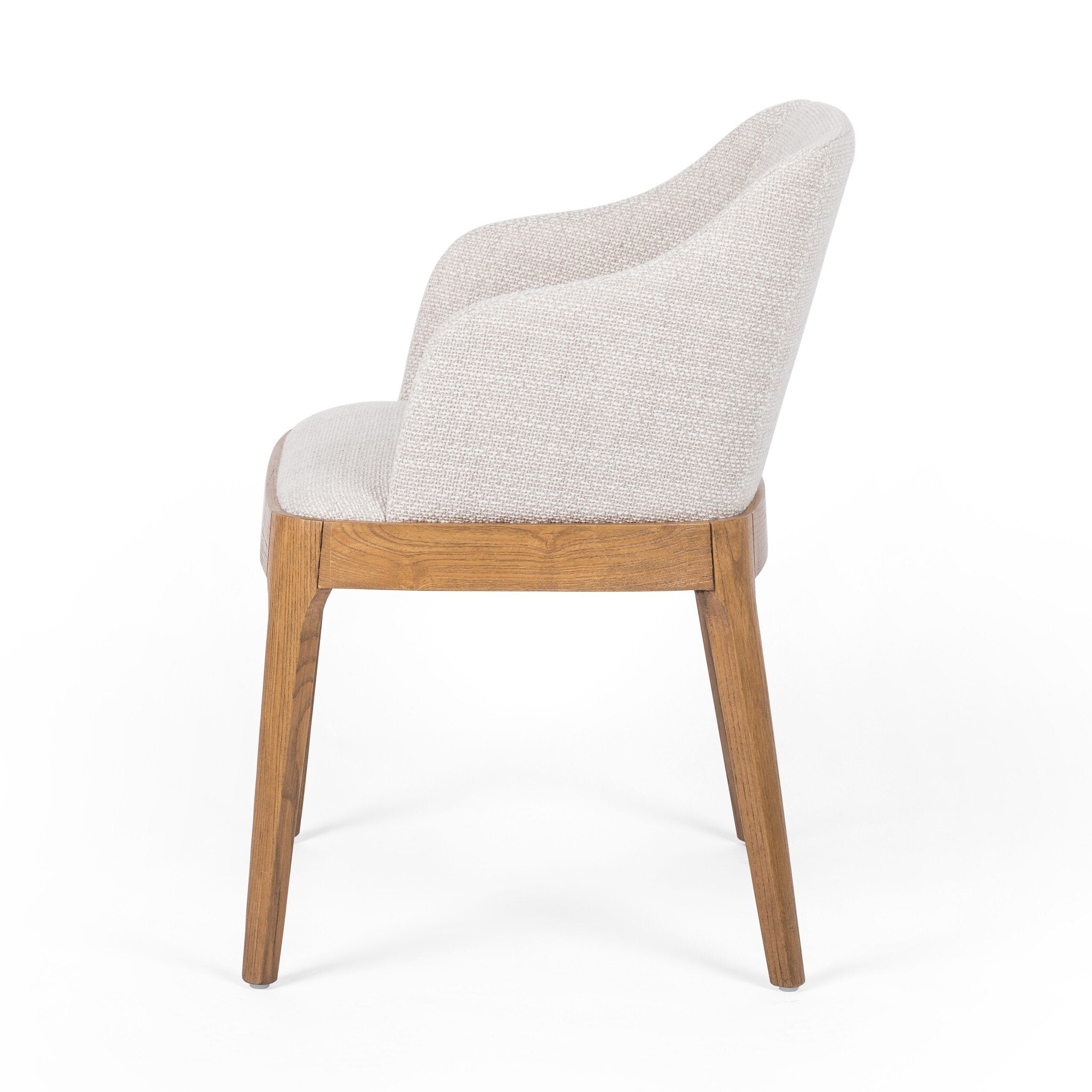Bryce Dining Chair in light honey solid nettlewood with high-performance upholstered seat, transitional hospitality seating side