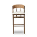 Brown wood bar stool with rounded woven back and light upholstered seat