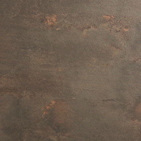 Close-up of concrete-style tabletop surface with mottled dark gray and warm rust speckles.