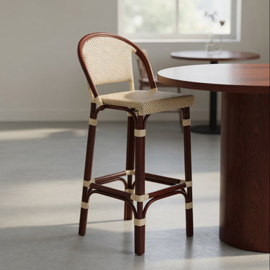 Bar stool with dark wood legs and beige speckled woven seat and back, angled view