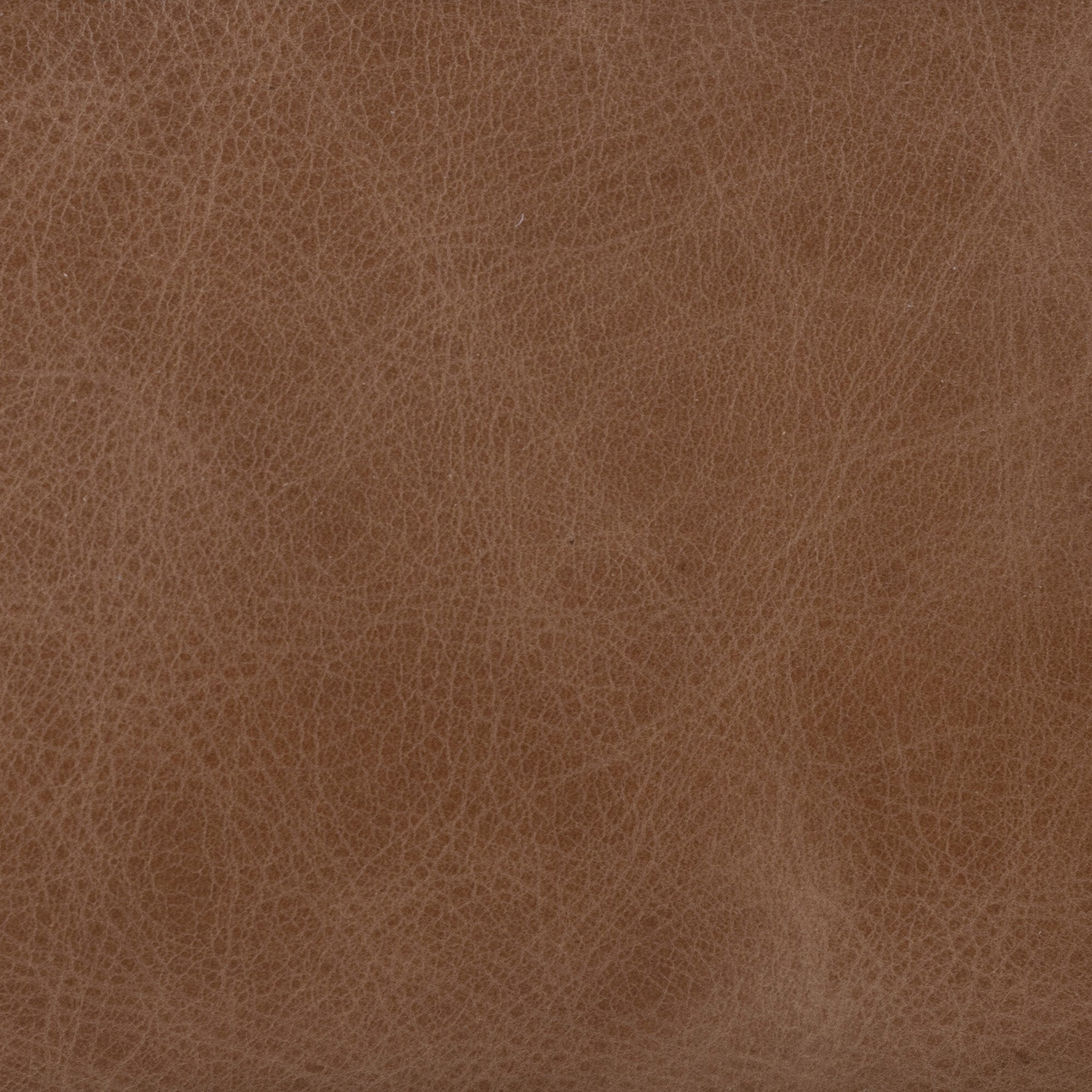 Tan faux-leather texture detail on stool upholstery