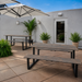 Outdoor double-top table with black legs and two rectangular concrete tops in dark gray.