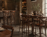 Wood bar stool with cross-back frame, round seat, and lower circular footrest.