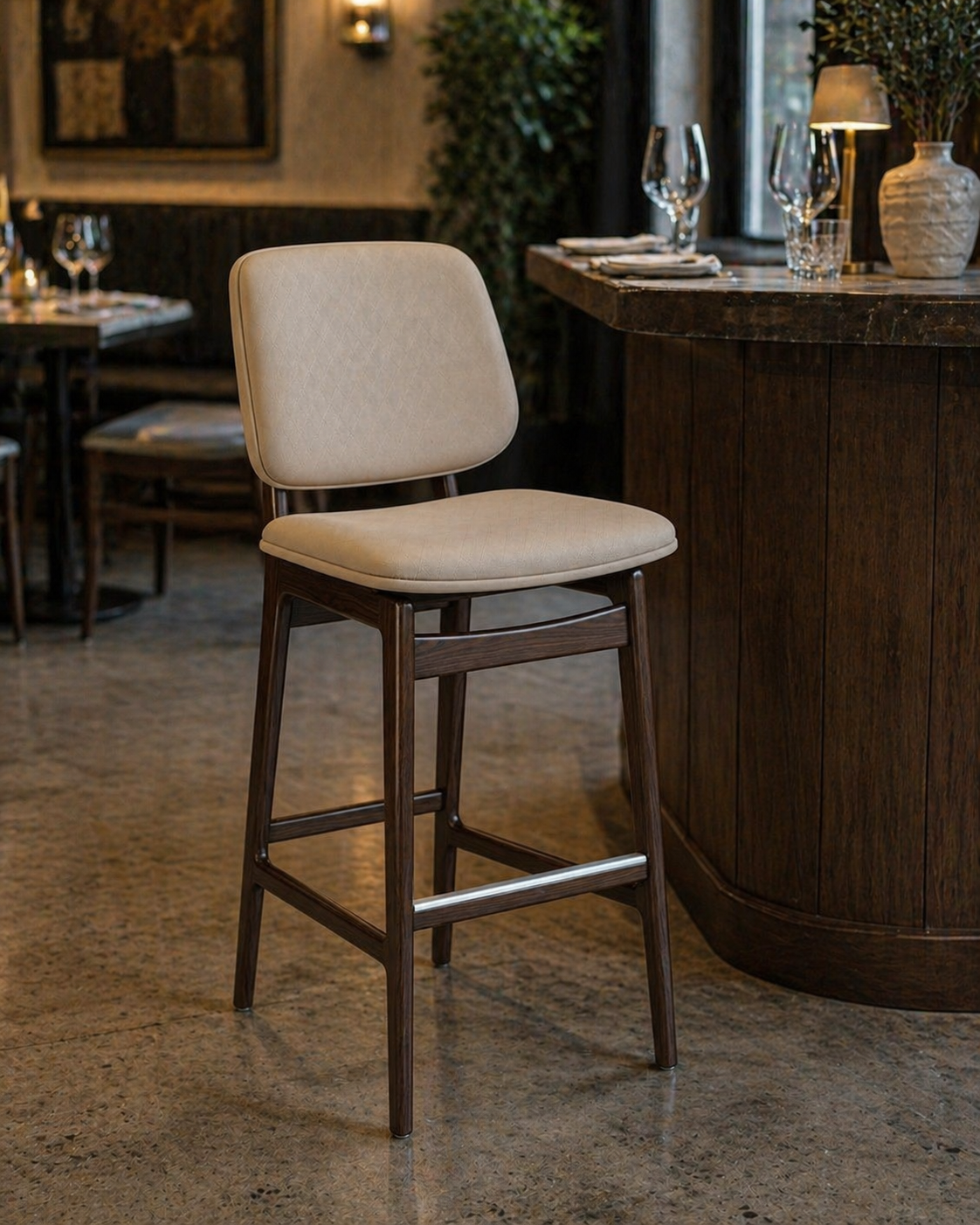 Upholstered bar stool with beige seat, dark wood legs and footrest