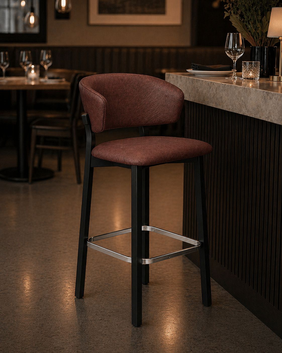 Brown upholstered bar stool with black legs and chrome footrest