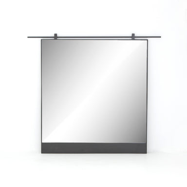 Chico square wall mirror featuring a unique vertical suspension bar in a hand-applied antiqued iron finish