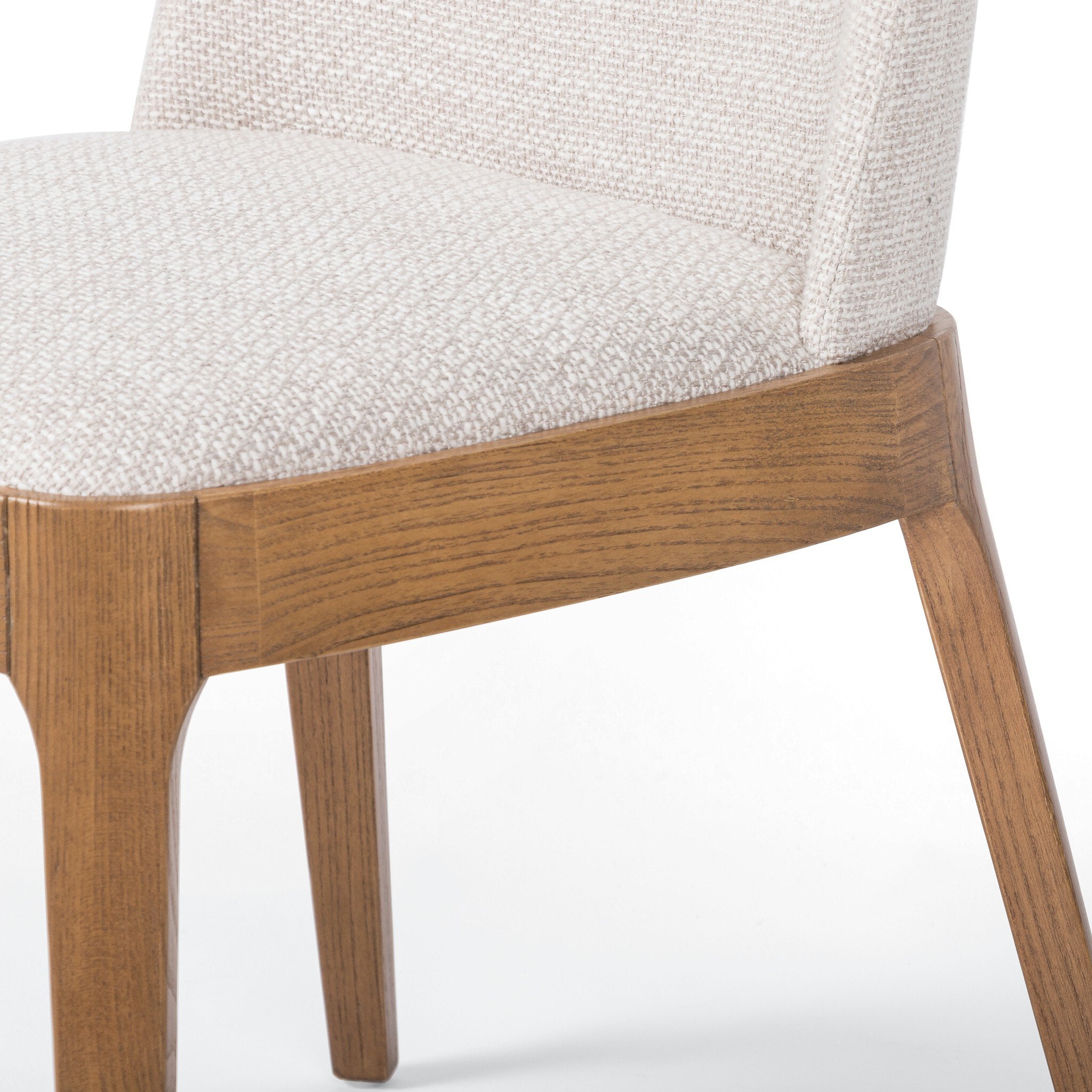 Close-Up Armless Bryce Dining Chair upholstered seat and tapered splayed legs, commercial dining chair design