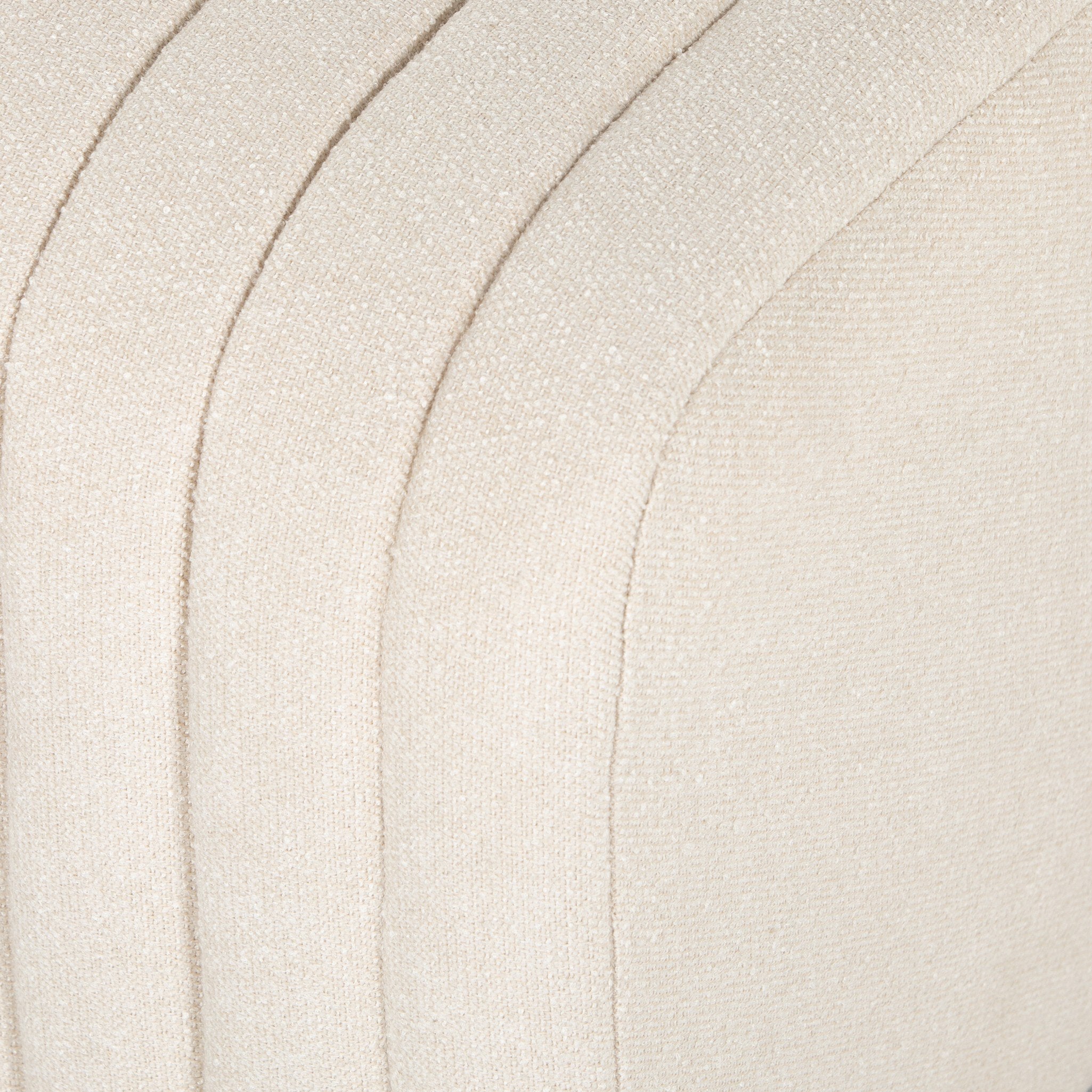 Close-up Custom Augustine dining banquette in neutral performance fabric with high-back tufted detailing and wood base.