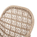 Close-up Modern low-armed outdoor bar stool with white wicker weaving and a bronze industrial frame for hospitality dining