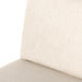 Cream upholstered seat cushion with stitched edge and fabric texture close-up