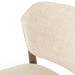Close-up of a Detail view of Joren Dining Chair showcasing curved wood frame and cushioned seat on white background