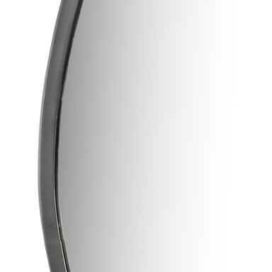 Close-up of the Brinley mirror's unique organic shape and mixed metal frame texture