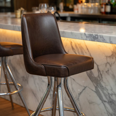 Close-up of the Camden bucket stool's ergonomic seat and reinforced frame designed for steady commercial movement