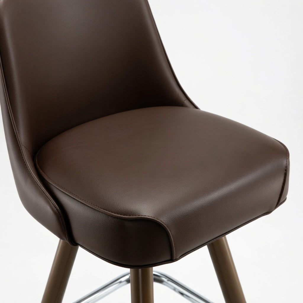Brown leather bar stool seat and curved back, padded upholstery with stitched edge