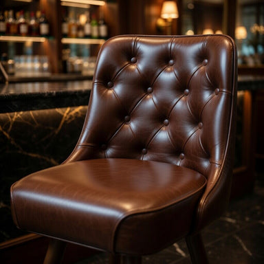 Close-up of the Inner Tufted stool's button detailing and tailored stitching designed for luxury commercial durability