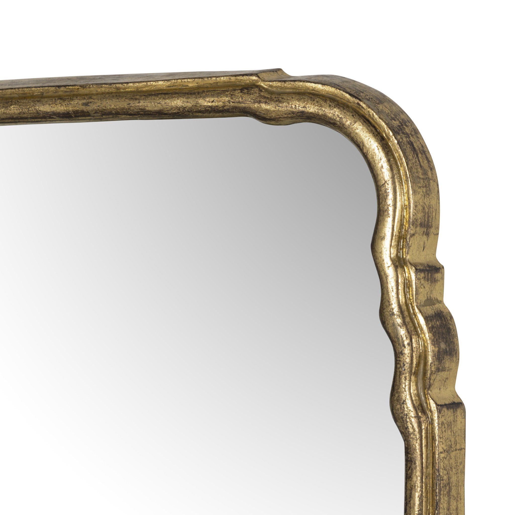 Close-up of the Loire mirror's aged texture on the gold leaf frame showing the arched top detail