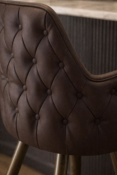 Close-up of the Regale stool's intricate button detailing and crisp seat edge designed for long-term commercial shape retention