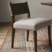 Armless dining chair with dark fabric backrest, beige upholstered seat, wood legs