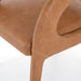 Close-up of a brown leather chair on a white background. Hawkins Dining Chair in Sonoma Butterscotch top-grain leather with a sculpted open-back frame.