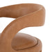 Close-up of a brown leather chair with a curved design on a white background. Hawkins Dining Chair in Sonoma Butterscotch top-grain leather with a sculpted open-back frame.