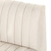 Close-up of a beige upholstered headboard with stitching details on a white background