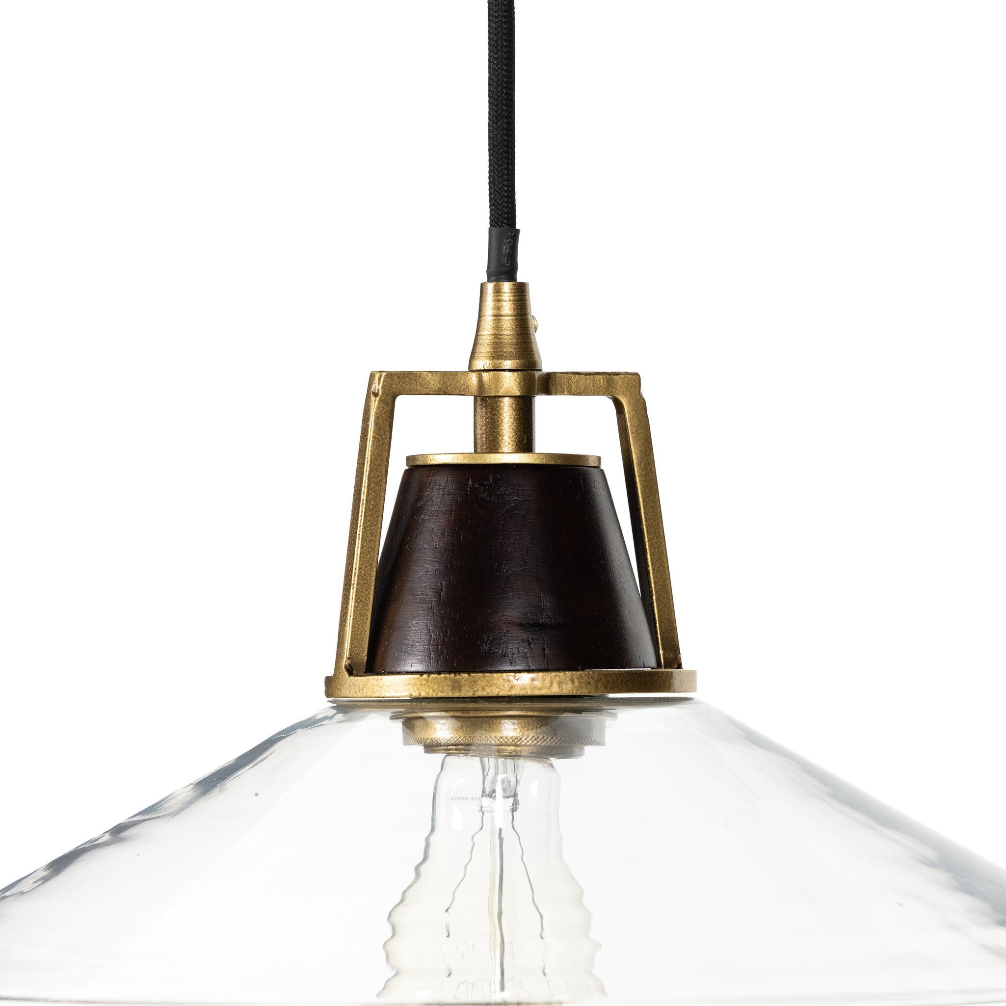Close up brass Novak 10-inch hand-hammered antique brass pendant light with clear glass detail 