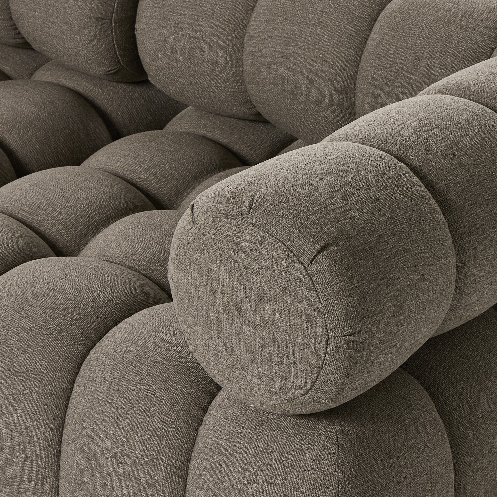 Outdoor sectional cushion detail in Alessi Fawn with rounded ends and stitched seams