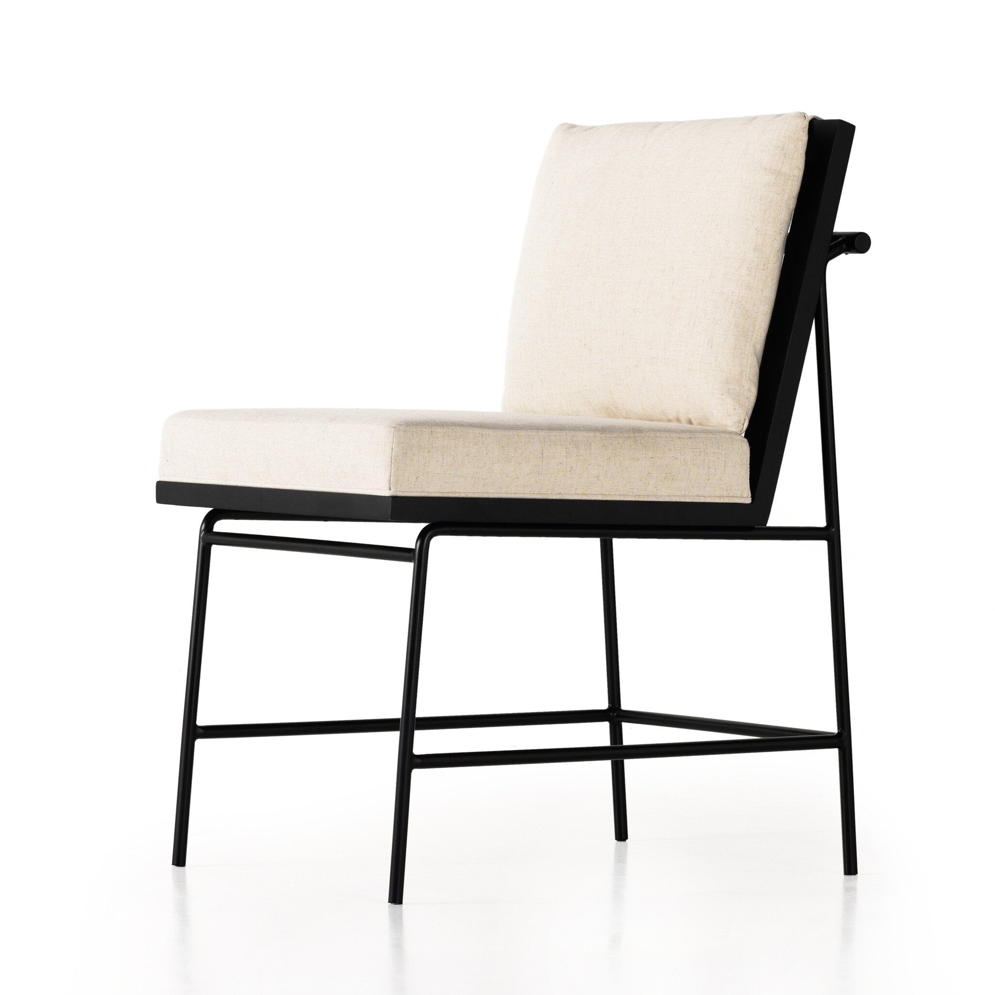 Close-up angled Crete Dining Chair with amber oak ladderback, black iron frame