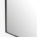 Corner Textured view of the Georgina iron matte black arch mirror showcasing the thin industrial-style profile