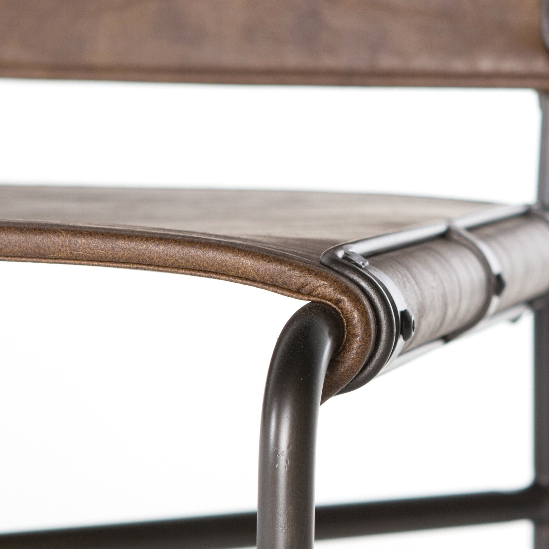 Corner bar detail Wharton Counter Stool featuring Distressed Brown faux leather and industrial steel legs