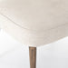 Corner cushion detail Orville Dining Chair in Cambric Ivory performance fabric with natural parawood legs