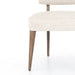 Corner cushion wooden leg detail Orville Dining Chair in Cambric Ivory performance fabric with natural parawood legs