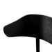 Black armless dining chair close-up of curved black backrest