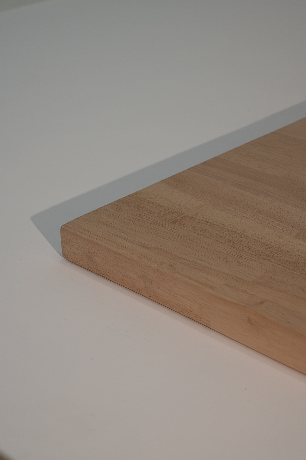 Corner of Modern whitewash butcher block table top in a coastal-inspired café with contract-grade wood construction