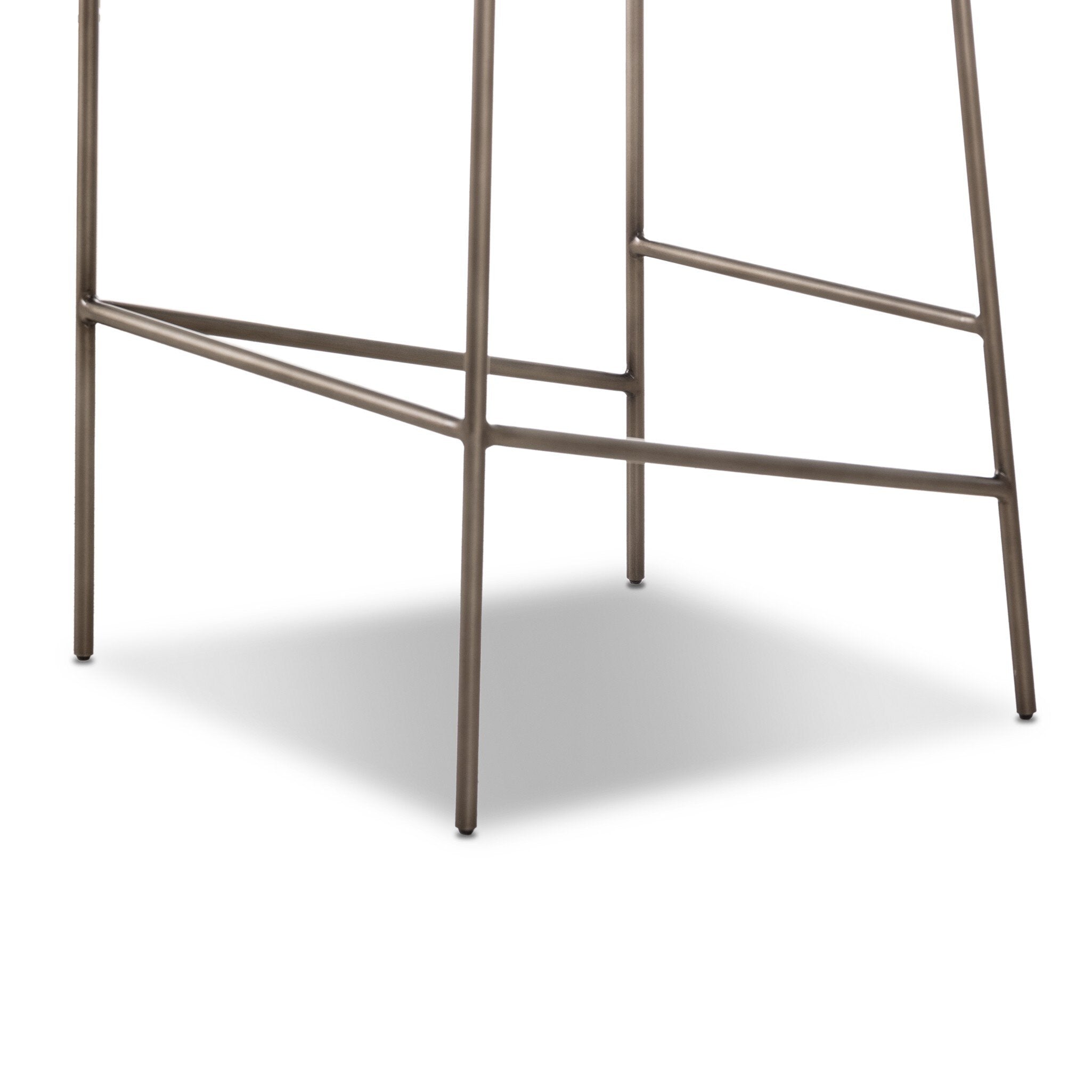 Metal base of upholstered bar stool with footrest bars and four legs in light finish