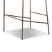 Metal base of upholstered bar stool with footrest bars and four legs in light finish