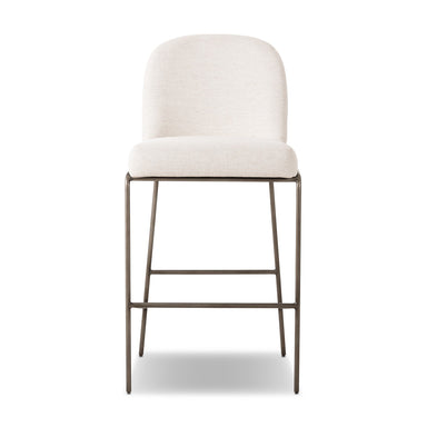 Crypton Nomad Snow Modern upholstered counter stool with a decorative scalloped back and high-performance fabric for hospitality interiors