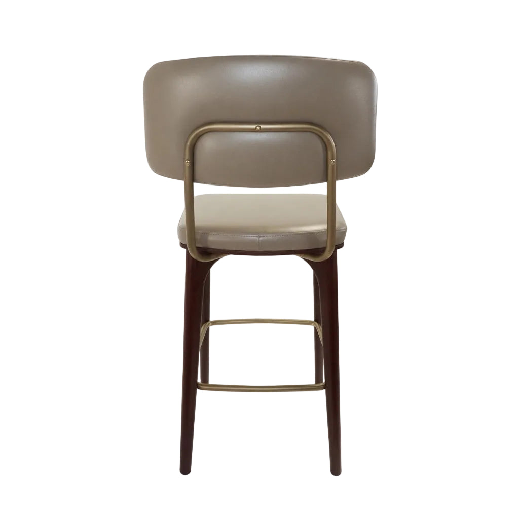 Upholstered bar stool with rounded back and beige seat, dark wood legs, gold underframe.