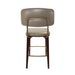 Upholstered bar stool with rounded back and beige seat, dark wood legs, gold underframe.