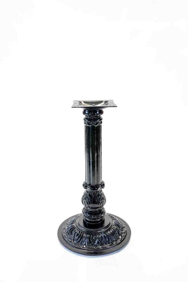 Decorative metal pedestal base on a white background