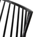 Close-up of dark wood chair back slats and curved top rail, smooth black finish