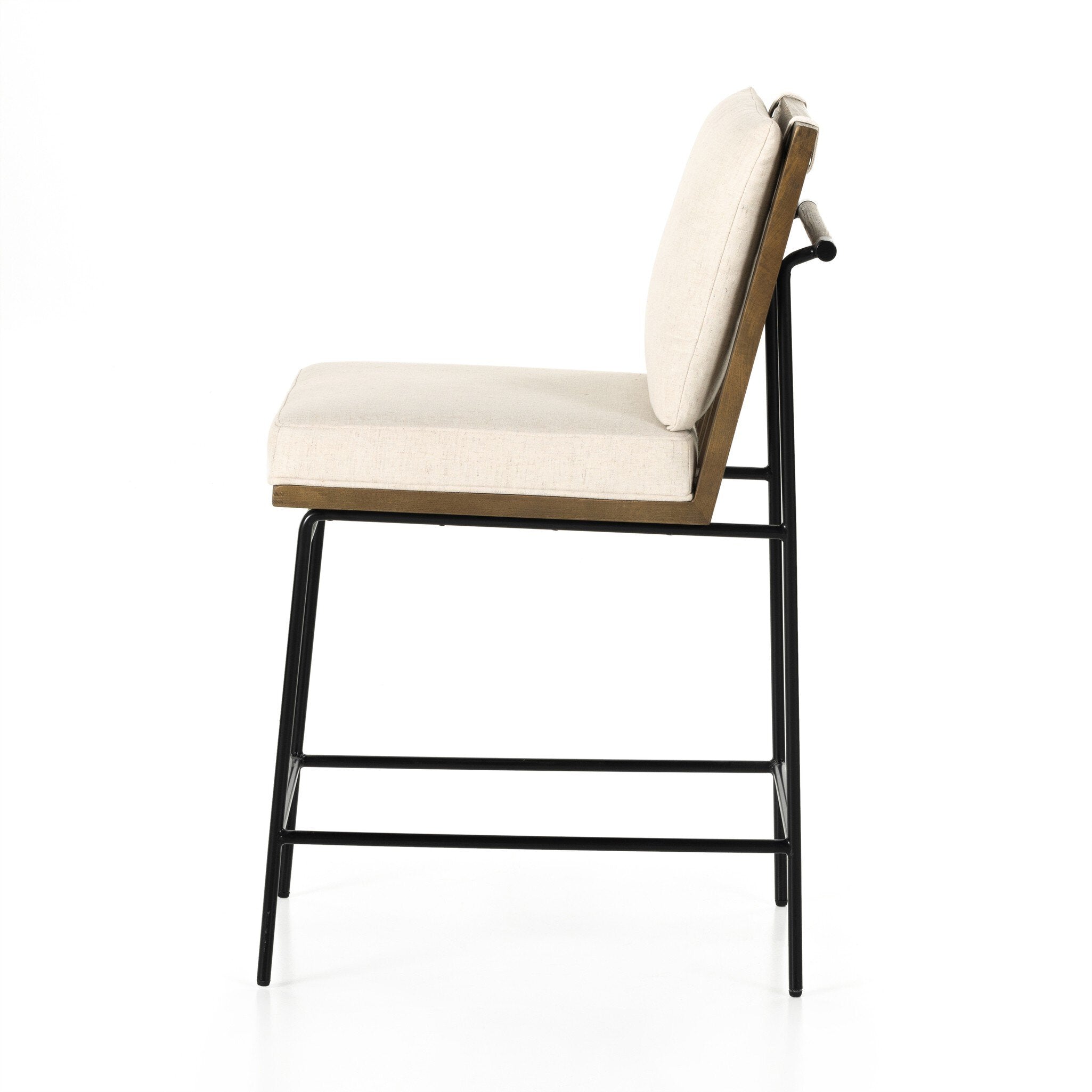 Counter stool with cream fabric seat and backrest, black metal legs and wood side frame