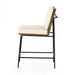 Counter stool with cream fabric seat and backrest, black metal legs and wood side frame