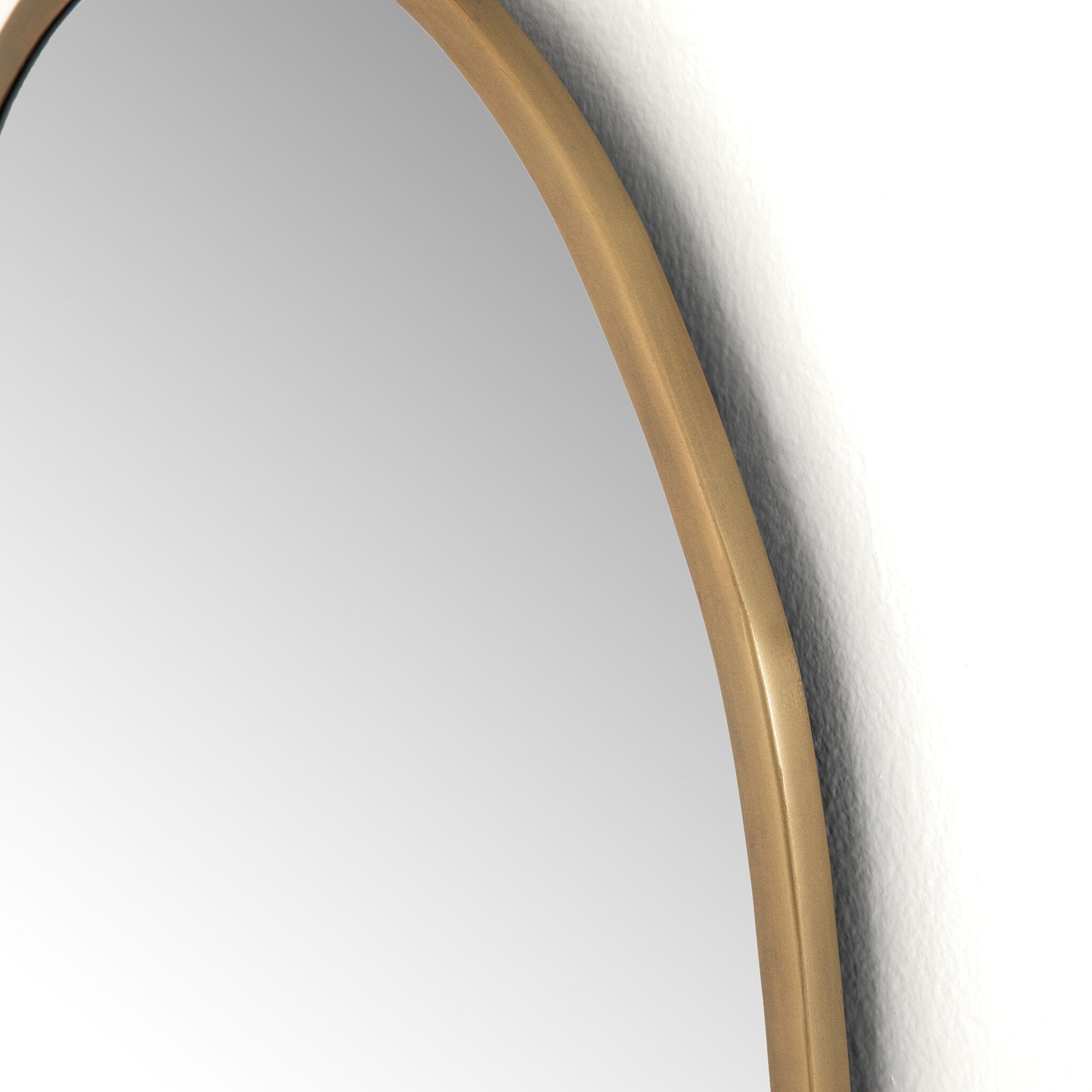 Detailed Corner Close-up of the Brinley mirror's unique organic shape and brass mixed metal frame texture