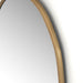 Detailed Corner Close-up of the Brinley mirror's unique organic shape and brass mixed metal frame texture